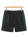Short CHALLENGER 8L | Short homme élastiqué noir bande verte