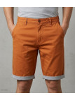 Bermuda uni en coton pour homme de la marque CHALLENGER modèle IBIZA2 coloris orange de face avec finitions revers contrastés.