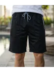 Bermuda en molleton pour homme de la marque CHALLENGER modèle ISAK1 de couleur noire avec poches latérales zippées.
