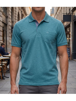 Polo manches courtes CHALLENGER modèle RUSTICO5 coloris bleu turquoise chiné en maille piquée de coton avec poche poitrine.