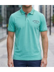 Polo manches courtes pour homme Winchester modèle Ragga3 en maille piquée vert menthe avec col boutonné et liserets contrastés.